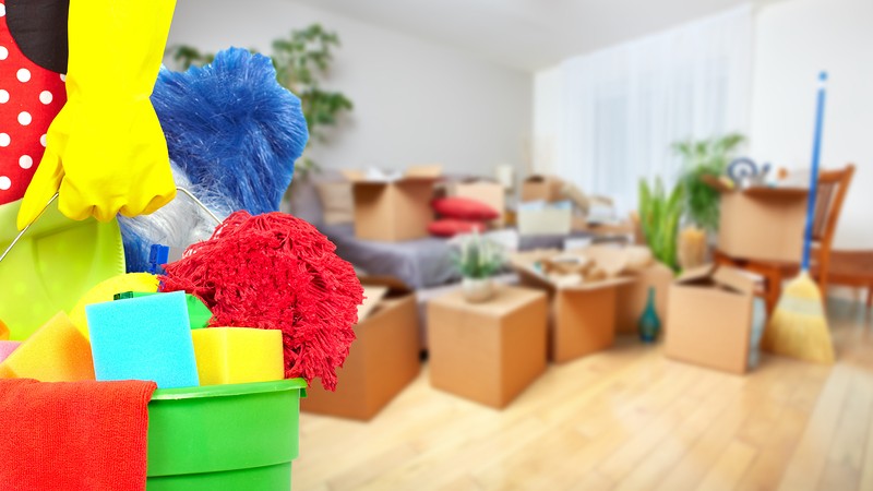 a bucket and cardboard boxes on the back