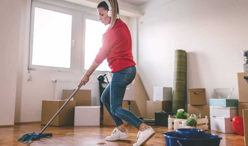 Woman in red t-shirt and blue jeans and headphone in her head