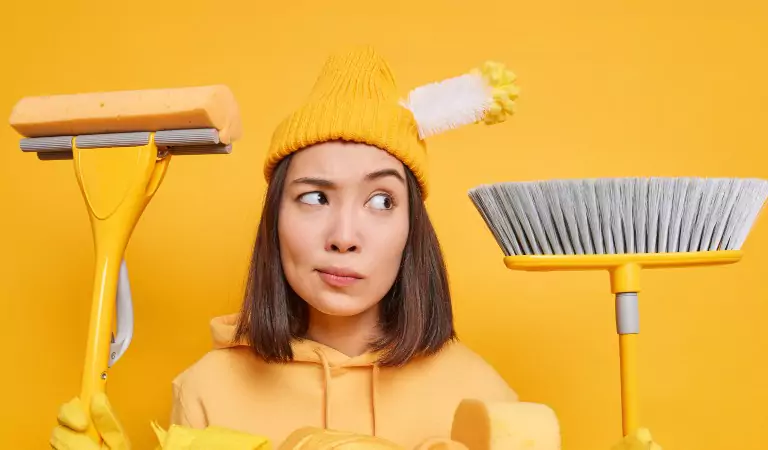 young woman with some cleaning supplies