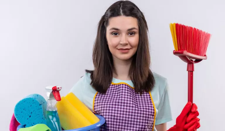young woman with some cleaning essentials