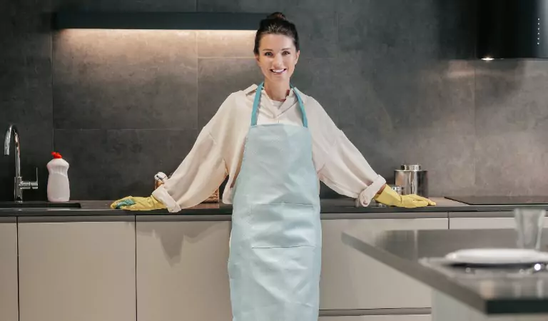 woman looking ready to clean her kitchen