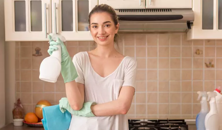 woman looking ready to clean her kitchen