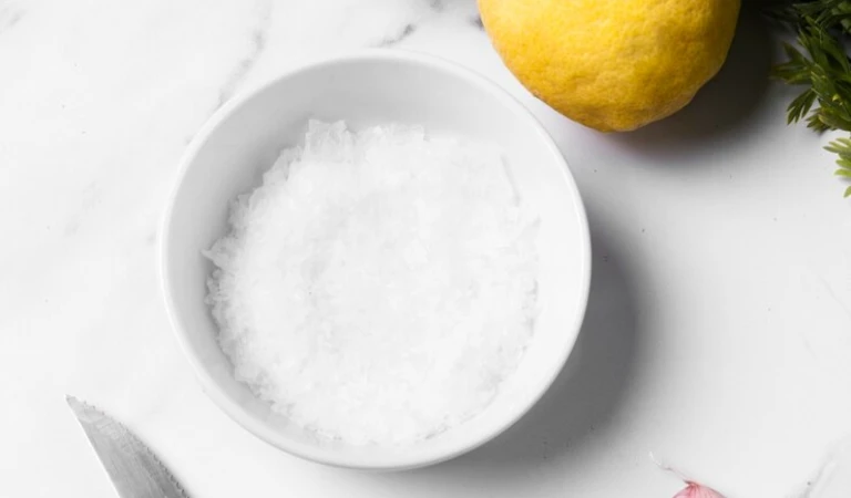 Salt in a bowl with a lemon