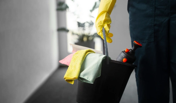 Front view man cleaning indoors