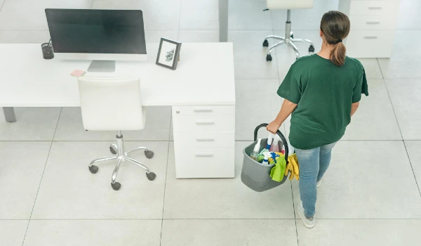 Shell clean it all with one call high angle shot of a woman cleaning a modern office