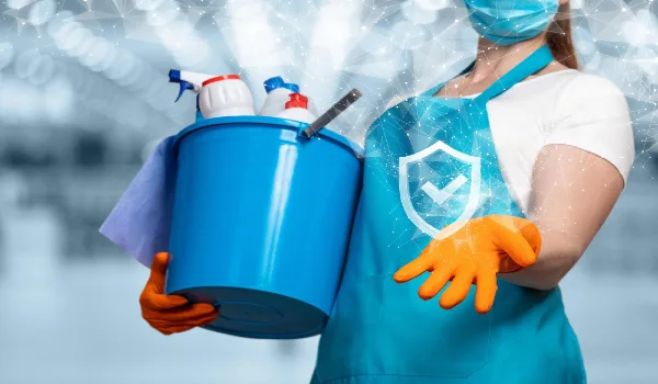 Quality cleaning conceptthe cleaning lady shows the symbol of quality service