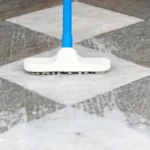 Scrub the tile floors with a mop and floor polish